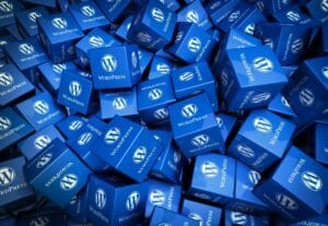 a pile of cubes printed with the WordPress logo